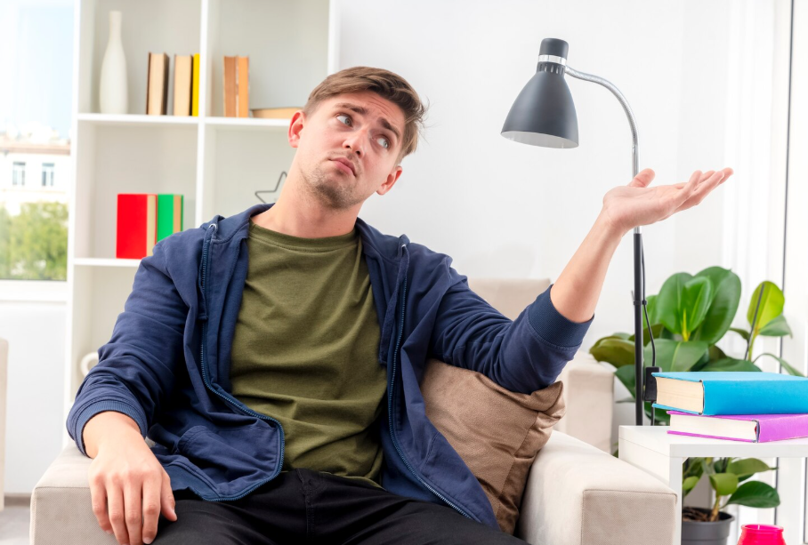 Person feeling bored at home, a reminder to embrace stillness for creativity