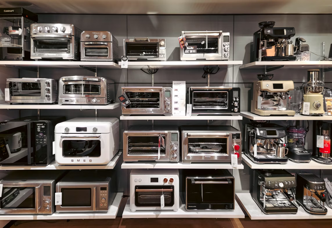 Store shelf of toaster ovens, microwaves, and espresso machines